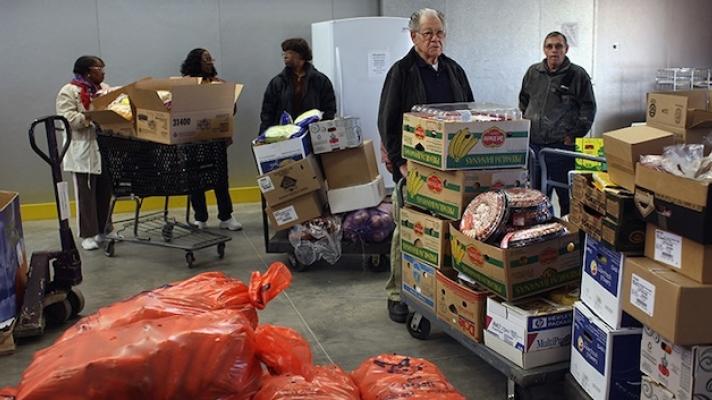 Food pantry workers unloading boxes